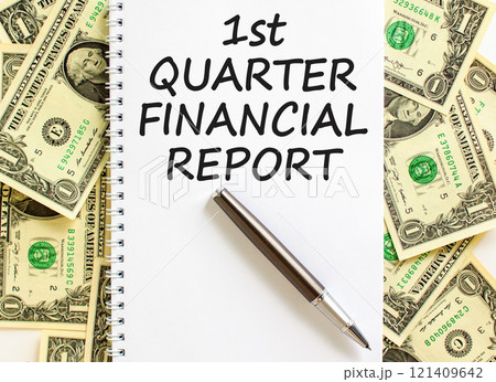 1st quarter financial report symbol. Concept words 1st quarter financial report on beautiful white note. Beautiful dollar background. Business 1st quarter financial report concept. Copy space. 1st quarter financial report symbol. Concept words 1st quarter financial report on beautiful white note. Beautiful dollar background. Business 1st quarter financial report concept. Copy space. 121409642