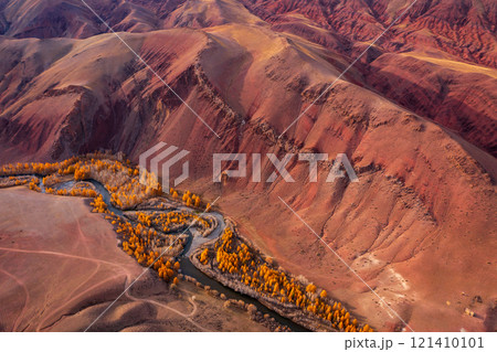 Aerial view of colorful mountain valley with winding river Aerial view of colorful mountain valley with winding river 121410101
