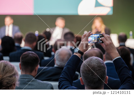 Audience Member Recording Business Conference Using Smartphone 121410131