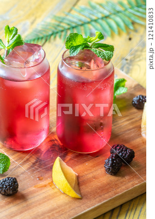 Blackberry Fizz Mocktail with mint, lime, and honey for a refreshing sip 121410833