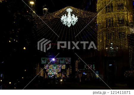 Christmas. Light. Christmas lights through the streets of Vigo. Decorating streets of the city. Fir tree with Christmas lights. Light tree. On. VIGO. SPAIN. 23 December 2024. Christmas. Light. Christmas lights through the streets of Vigo. Decorating streets of the city. Fir tree with Christmas lights. Light tree. On. VIGO. SPAIN. 23 December 2024. 121411071