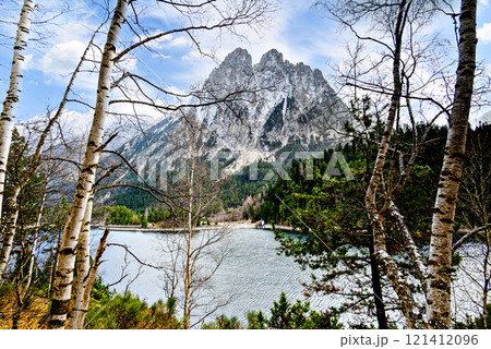 Image of Sant Maurici Lake with snow-capped mountains, in the Aigues Tortes National Park, in the Lleida Pyrenees, Catalonia, Spain Image of Sant Maurici Lake with snow-capped mountains, in the Aigues Tortes National Park, in the Lleida Pyrenees, Catalonia, Spain 121412096