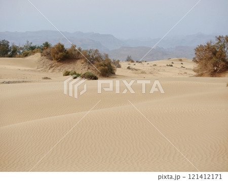 A sand desert dune at the background of mountains in Maspalomas, Gran Canaria 121412171