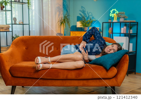 Sick ill Caucasian woman suffering from period cramps, painful stomach ache menstrual pain diarrhea Sick ill Caucasian woman suffering from period cramps, painful stomach ache menstrual pain diarrhea 121412340