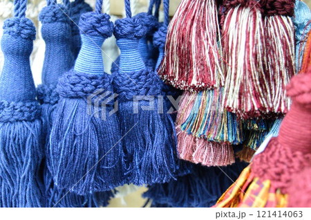 decorative brush pendants for the canopy. colored tassels made of thread for hanging on curtains. items for needlework sewing and embroidery for home comfort and window decoration. High quality photo 121414063