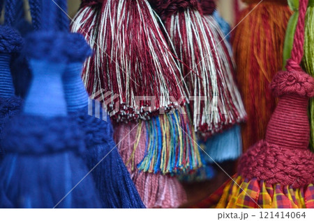 decorative brush pendants for the canopy. colored tassels made of thread for hanging on curtains. items for needlework sewing and embroidery for home comfort and window decoration. High quality photo 121414064