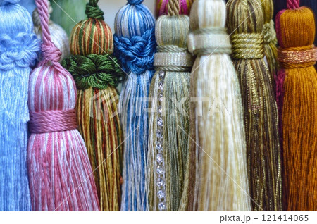 decorative brush pendants for the canopy. colored tassels made of thread for hanging on curtains. items for needlework sewing and embroidery for home comfort and window decoration. High quality photo decorative brush pendants for the canopy. colored tassels made of thread for hanging on curtains. items for needlework sewing and embroidery for home comfort and window decoration. High quality photo 121414065