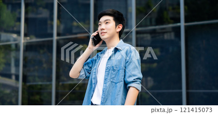 Portrait of handsome Asian student using smartphone Portrait of handsome Asian student using smartphone 121415073