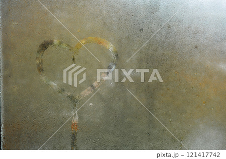 A heart drawing on a wet window. concept of love A heart drawing on a wet window. concept of love 121417742