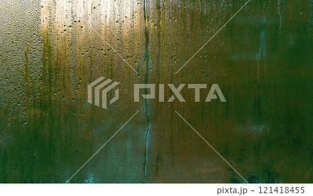 wet glass abstract background. gold and green shades 121418455