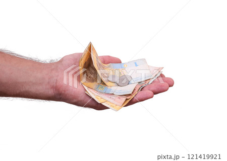Ukrainian hryvnia and coins in your hand. isolated. Ukrainian hryvnia and coins in your hand. isolated. 121419921