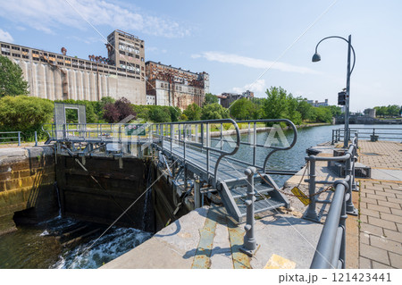 Montreal, Quebec, Canada - August 5 2021 : Lock No. 2 of Lachine Canal. Lachine Canal National Historic Site in Old Port of Montreal. Silo No.5 in the background. 121423441