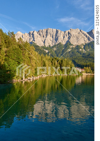 Scenic View of Eibsee Lake with Zugspitze Mountain at Sunset in Bavaria, Germany. Stunning Eibsee Lake with Zugspitze Reflection at Sunset in Bavaria, Germany. Tranquil Alpine Scene Captures the 121424035