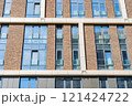 Facade of a modern residential building, building texture 121424722