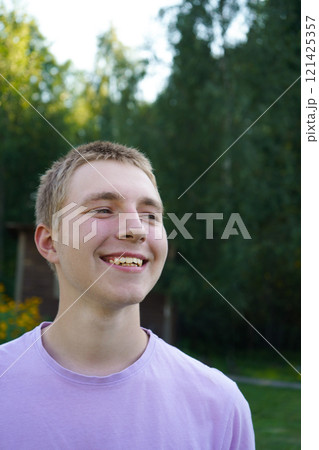 Portrait of an attractive smiling teenager 121425357