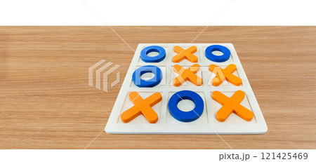 A game of Tic-Tac-To on a wooden table for fun entertainment. 121425469
