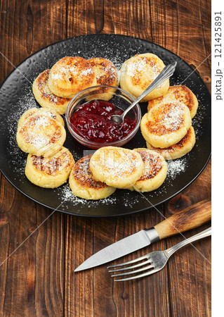 Cottage cheese pancakes or curd fritters stack. Cottage cheese pancakes or curd fritters stack. 121425891