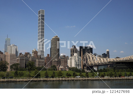 Queensboro Bridge in New York City, spanning the East River. new york manhattan view from east river 121427698