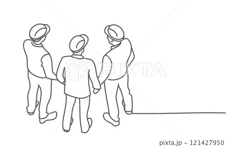 Engineers in construction helmets are standing 121427950