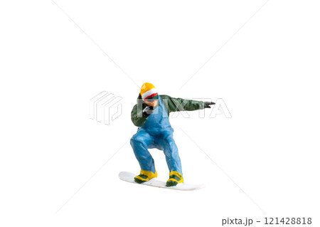 Miniature figurine depicting a snowboarder in mid-motion isolate on white background with clipping path 121428818