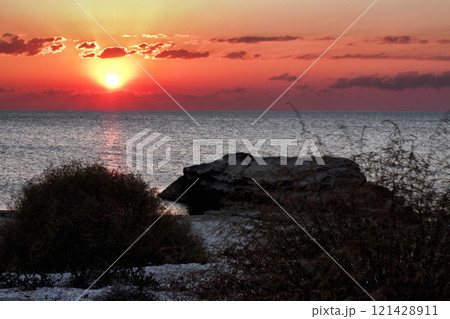 Evening rocky shore of the Caspian Sea. Sunset. 121428911