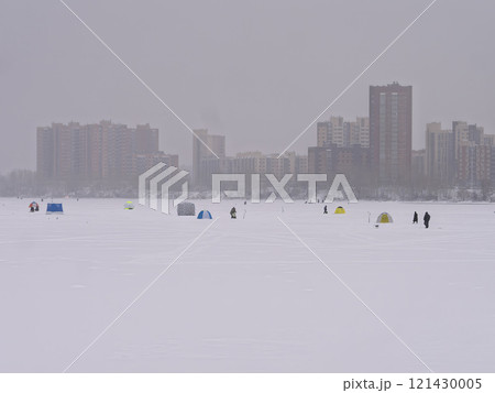 Ice fishing on the river ice in the city. 121430005