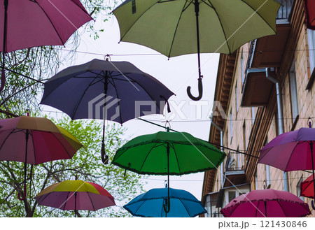 Colorful Umbrellas Hanging Outdoors in Spring 121430846