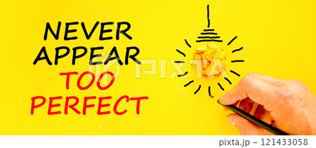 Never appear too perfect symbol. Concept words Never appear too perfect on beautiful yellow paper. Beautiful yellow background. Businessman hand. Business never appear too perfect concept. Copy space. 121433058
