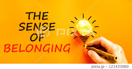 The sense of belonging symbol. Concept words The sense of belonging on beautiful orange paper. Beautiful orange background. Businessman hand. Business and the sense of belonging concept. Copy space. The sense of belonging symbol. Concept words The sense of belonging on beautiful orange paper. Beautiful orange background. Businessman hand. Business and the sense of belonging concept. Copy space. 121433060