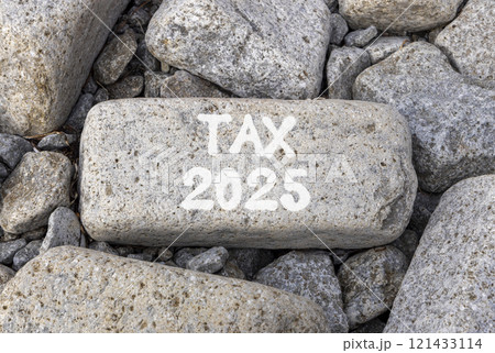 Planning tax 2025 new year symbol. Concept words Tax 2025 on beautiful grey stone. Beautiful grey stones background. Business tax 2025 new year concept. Copy space. 121433114