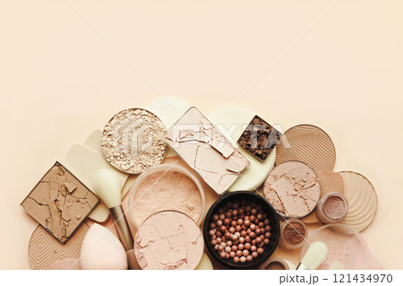 Varieties of face powders and foundations for perfect complexion, basic make up products to even out and matte skin, beauty cosmetics with brushes and sponges, selective focus Varieties of face powders and foundations for perfect complexion, basic make up products to even out and matte skin, beauty cosmetics with brushes and sponges, selective focus 121434970