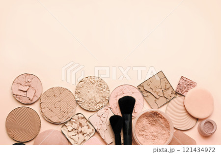 Varieties of face powders and foundations for perfect complexion, basic make up products to even out and matte skin, beauty cosmetics with brushes and sponges, selective focus Varieties of face powders and foundations for perfect complexion, basic make up products to even out and matte skin, beauty cosmetics with brushes and sponges, selective focus 121434972