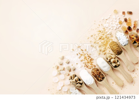 Mix of sugar varieties: unbleached, brown and white, refined and unrefined, granulated and cubes Mix of sugar varieties: unbleached, brown and white, refined and unrefined, granulated and cubes 121434973