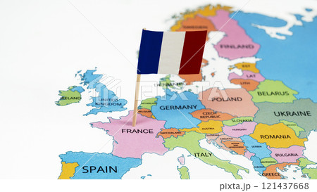 A map of France with the national flag of France on it. The flag is a tricolor featuring three vertical bands colored blue, white, and red 121437668