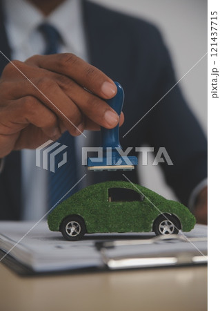 Judge gavel and miniature car symbolize auction or court case against driver who has accident and receiving vehicle insurance payment be on table in front of hands of lawyers. Selective focus Judge gavel and miniature car symbolize auction or court case against driver who has accident and receiving vehicle insurance payment be on table in front of hands of lawyers. Selective focus 121437715