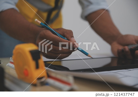 Image of engineer meeting for architectural project. working with partner and engineering tools on workplace vintage tone. 121437747