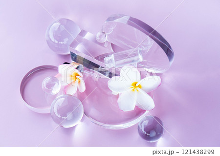 Cosmetic elements artfully arranged on a soft pink backdrop highlight aloe serum. Cosmetic elements artfully arranged on a soft pink backdrop highlight aloe serum. 121438299