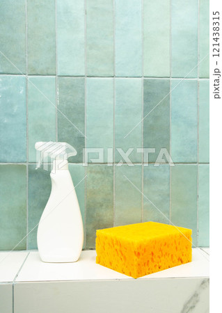 Using epoxy adhesive and grout for effective tile repair with cleaning supplies nearby. Flushing for epoxy grout for successful repair. Vertical photo. 121438315