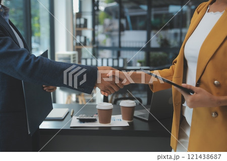 Business handshake for teamwork of business merger and acquisition,successful negotiate,hand shake,two businessman shake hand with partner to celebration partnership and business deal concept 121438687