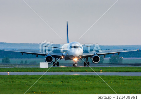 U-turn of a passenger jet plane on the runway. Front view 121439961