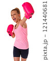 Portrait of caucasian attractive young girl in sportswear with pink boxing gloves with workout and pose boxing show punch in gym, isolated 121440681