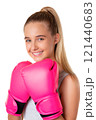 Close up portrait of caucasian attractive young girl in sportswear with pink boxing gloves, isolated 121440683