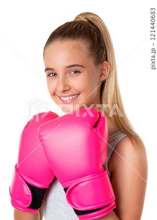 Close up portrait of caucasian attractive young girl in sportswear with pink boxing gloves, isolated Close up portrait of caucasian attractive young girl in sportswear with pink boxing gloves, isolated 121440683