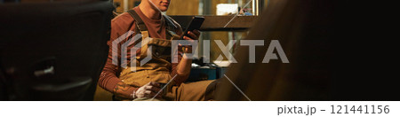 Mechanic Resting After Work In Service Mechanic Resting After Work In Service 121441156