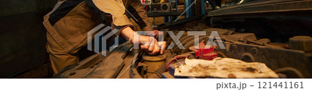 Mechanic Checking The Car Engine 121441161