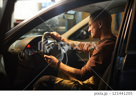 Mechanic Doing Diagnostics After Repairment 121441205