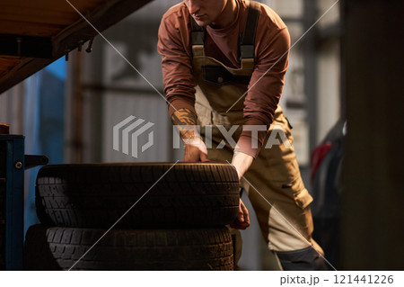 Mechanic Exploiting Tires In Service Mechanic Exploiting Tires In Service 121441226