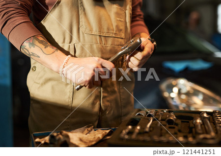Mechanic Using Tools To Repair The Car Mechanic Using Tools To Repair The Car 121441251