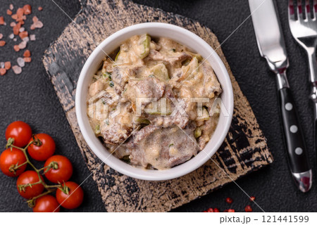 Bowl of food with beef, bulgur, tomatoes, zucchini and sauce Bowl of food with beef, bulgur, tomatoes, zucchini and sauce 121441599