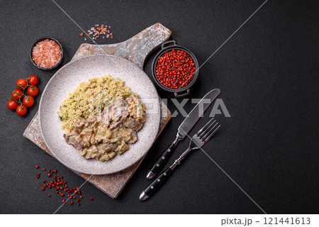 Bowl of food with beef, bulgur, tomatoes, zucchini and sauce Bowl of food with beef, bulgur, tomatoes, zucchini and sauce 121441613